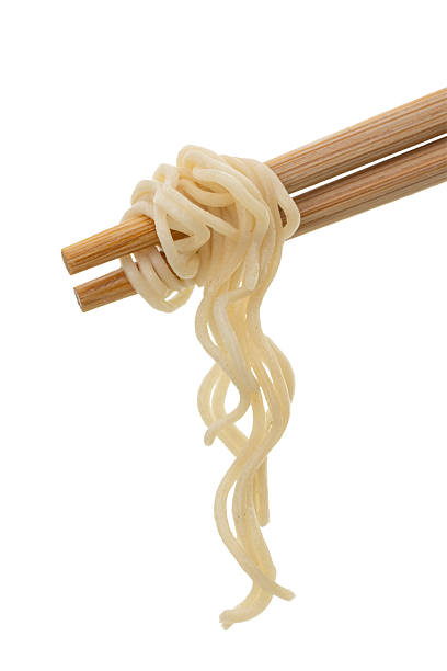 Noodles on chopsticks isolated on white background
