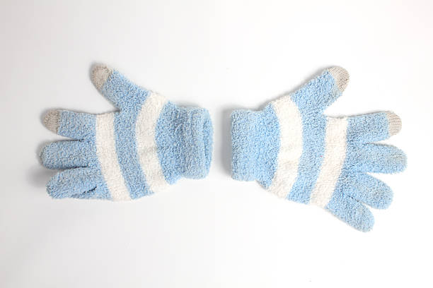 A pair of thick winter gloves with striped pattern to warm hands isolated on white background