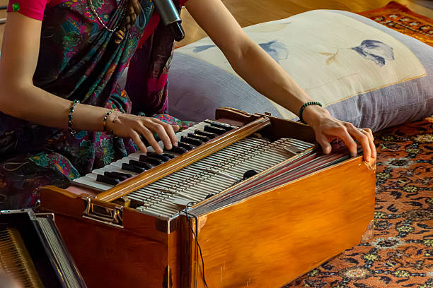 istock Woman plays harmonium as part of devotional practice causing meditative state 2258755518