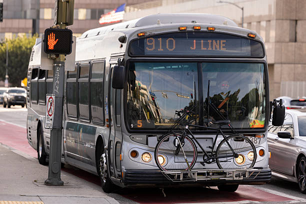 Los Angeles, California, USA - January 25, 2026: A J Line bus holds a bicycle on its front rack as it heads north to the 7th street Metro Station.