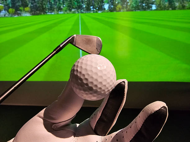 istock Golf swing practice with a club and ball indoors at a virtual simulation 2258786319