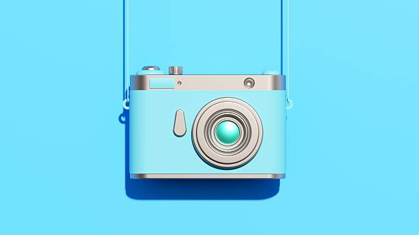 This Digitally Generated Image features a stylized blue Camera - Photographic Equipment hanging against a matching Blue Background. The Retro Style 3D Illustration combines Simplicity in Design with Pastel Colored aesthetics, highlighting the Lens - Optical Instrument and silver Shutter details. The clean composition of this Single Object creates a Modern look suitable for Photography, Memories, and Social Media themes. Perfect for Travel, Vacations, and Creative projects. Ideal for Technology companies, Photo Messaging apps, and Art And Craft promotions seeking a Vibrant Color visual with ample Copy Space.