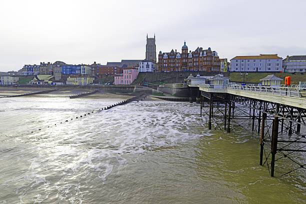 View of Lytham St Annes pier in the centre of Lytham St Annes, UK.  People can be seen on the beach