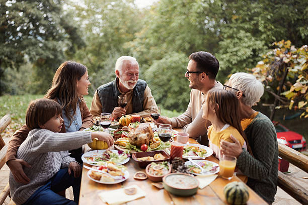 istock Happy multi-generation family enjoying in lunch on a terrace. 2258794467