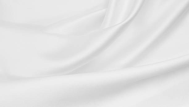 istock Smooth elegant white silk or satin luxury cloth texture as wedding background. Luxurious background design 2258810224