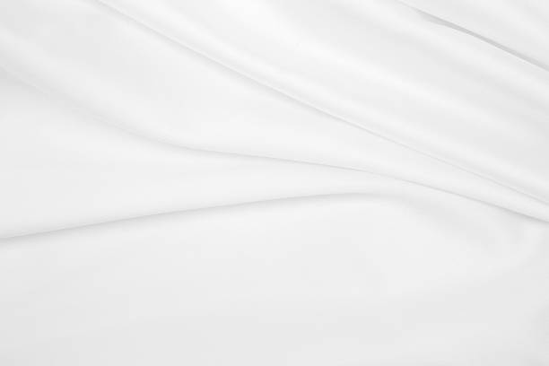 istock Smooth elegant white silk or satin luxury cloth texture as wedding background. Luxurious background design 2258810353