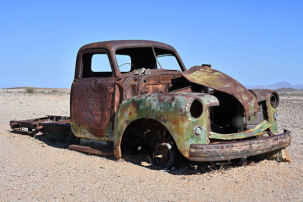 An abandoned rusty car in the Namib Desert, Namibia, Africa