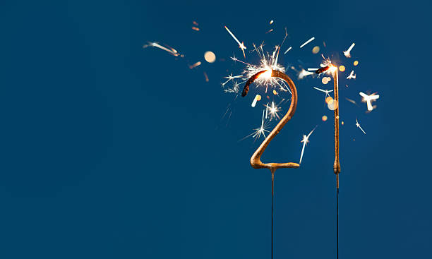 21 years celebration festive background with copy space made with Bengal fires in the form of number Twenty one.