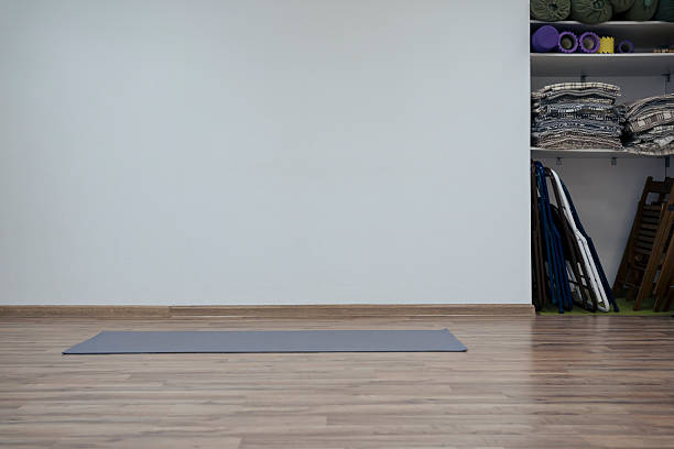 Workout space with yoga mat and equipment without people