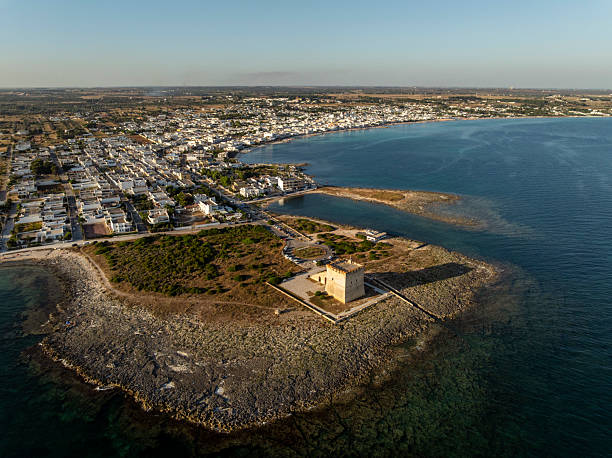 Aerial view of the small coastal town of Torre Lapillo in Apulia on the Mediterranean Sea in the late afternoon sunshine.