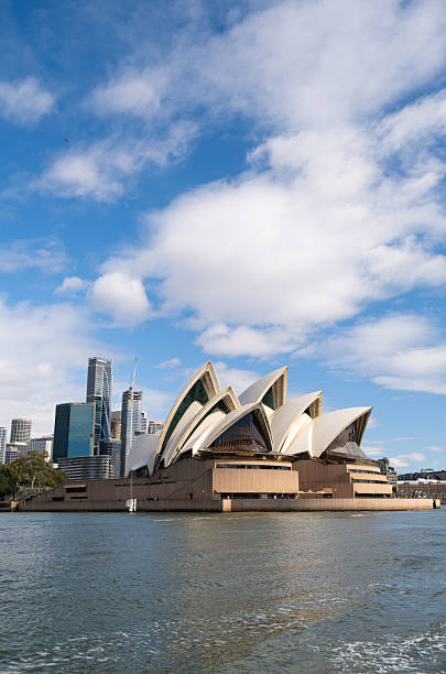 Sydney Australia - August 24, 2025: A bright afternoon in Sydney, New South Wales, and this is the view from a ferry looking across the Harbour towards the iconic shape of the city's Opera House.