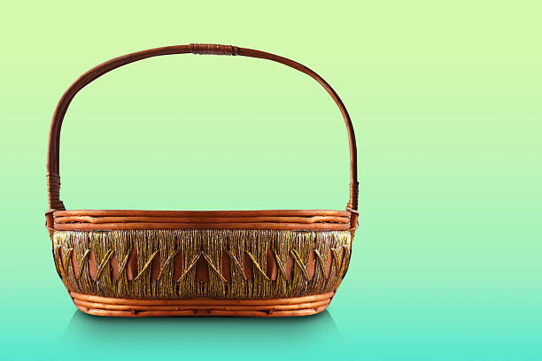 front view oval Wicker Basket Decorated with gold and white thread in the middle on gradient green background, object, decor, fashion, copy space