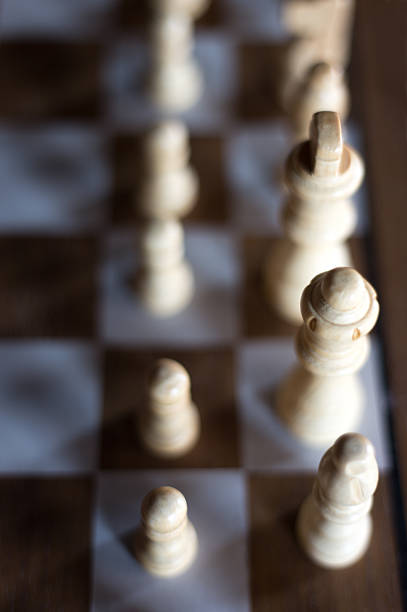 White Chess Pieces on Brown and White Chess Board Close-Up