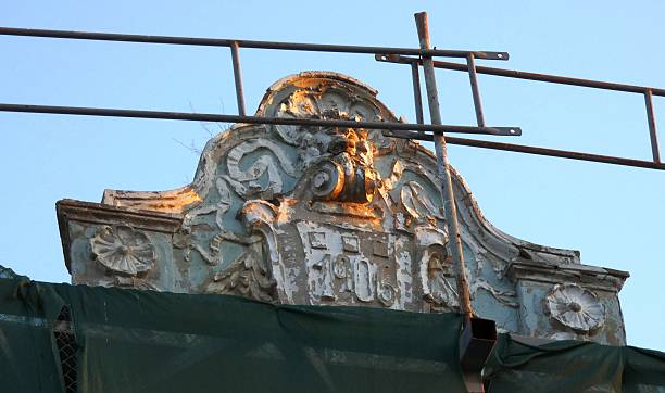 Close-up of an ornate architectural pediment dated 1906 from the former Hotel Paris in Varna, Bulgaria, captured during restoration, highlighting historic facade details and heritage architecture, 2019