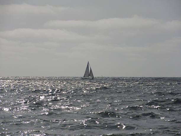 Distant Sailboat on Afternoon Sea