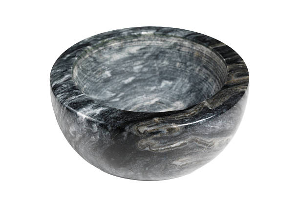 Crafted stone bowl made from dark marble material