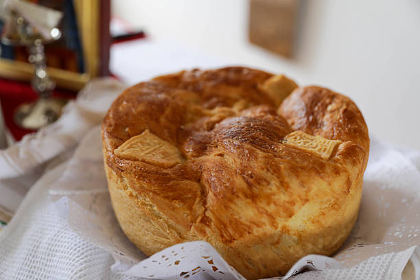 Freshly Baked Traditional Homemade Bread Presented on a Table With Natural Light, Golden Crust Texture, And Rustic Bakery Atmosphere.