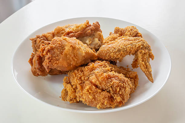 istock Crispy fried chicken in white plate on wood table 2258949499