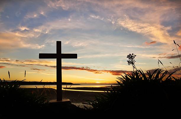 Dark cross at Foxton Beach Estuary as the sun goes down.