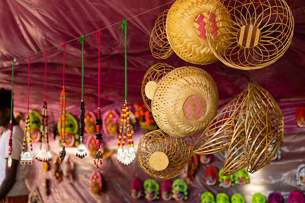 Number of different hand made handicraft wooden and bamboo souvenir on sale at a roadside Indian shop