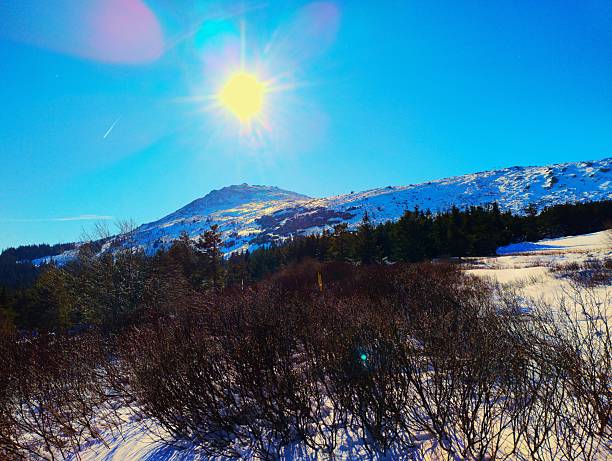 Winter landscape with snow and ice. Stunning white mountain and forest scenery from winter. Sunshine in the Taunus Mountains, Hesse, Germany