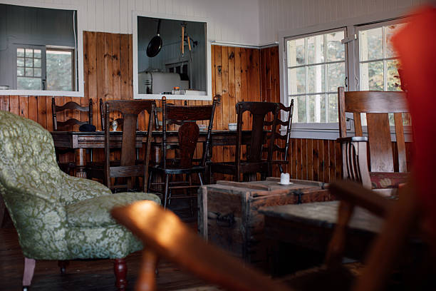 Green upholstered armchair positioned inside a rustic home interior, suggesting comfort, nostalgia, and quiet living.