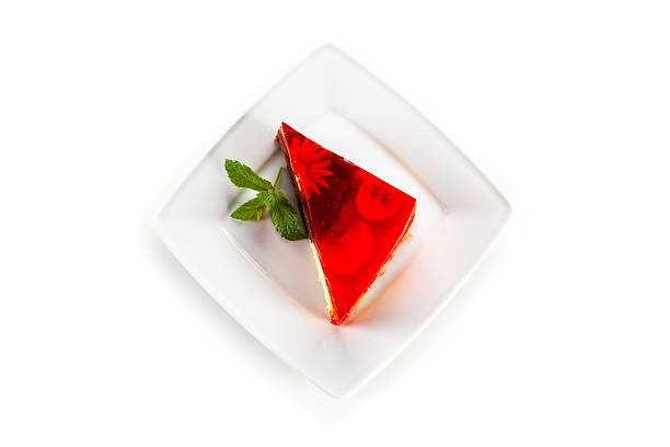 Pound cake with fruit jelly on white background
