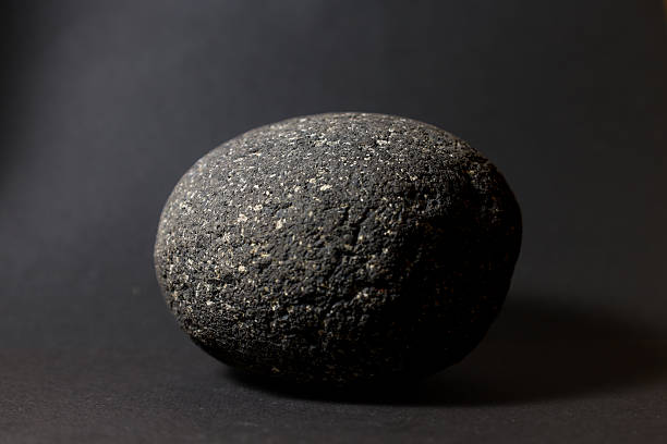 istock Lava Rock Texture on Dark Background with Copy Space 2259006398