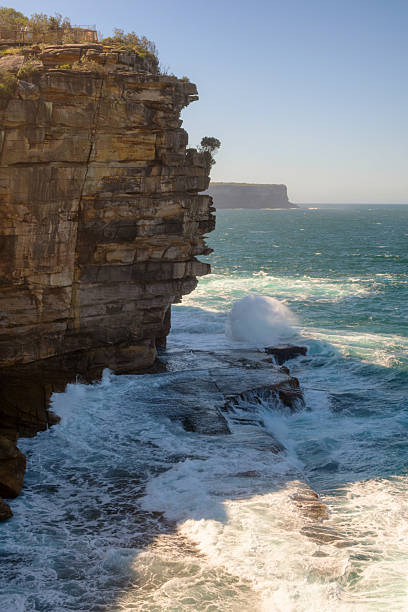 Waves crash against the cliffs on the seaward side of Watsons Bay in Sydney.