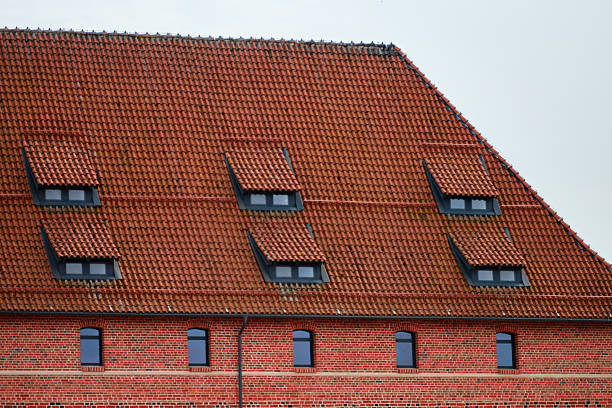 Two dormer windows on an older home
