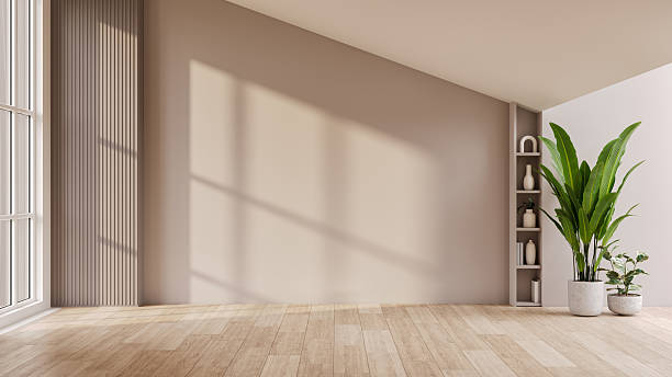 istock Empty room interior with a stylish armchair, natural light from a window, and a blank wall for mockup. Minimalist home background.3d render 2259032091