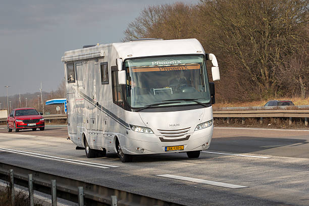 Medenbach, Germany - January 22, 2026: Motor home driving on German highway A3 southbound. Some road users in the background.