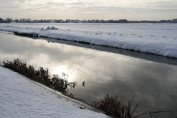 Snow on the riverbank