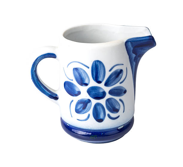 Close up of a woman holding a mug in her hands, her fingers stained blue with paint. She is decorating her first home, painting her walls blue. She is a first time home owner in the North East of England.\n\nVideos are available similar to this scenario.