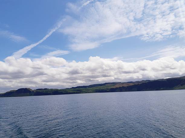 istock Lush Green Cliffs and Rolling Clouds Over the Hebridean Sea 2259066870