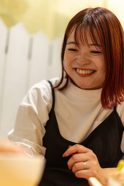 Happy mother smiling in cafe