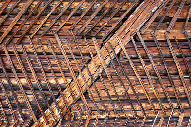Detailed view of traditional wooden wall structure with timber beams and wooden slats. Rustic construction detail showing natural wood texture, craftsmanship, and traditional wall building techniques.