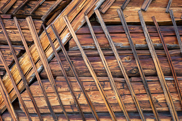 Detailed view of traditional wooden wall structure with timber beams and wooden slats. Rustic construction detail showing natural wood texture, craftsmanship, and traditional wall building techniques.