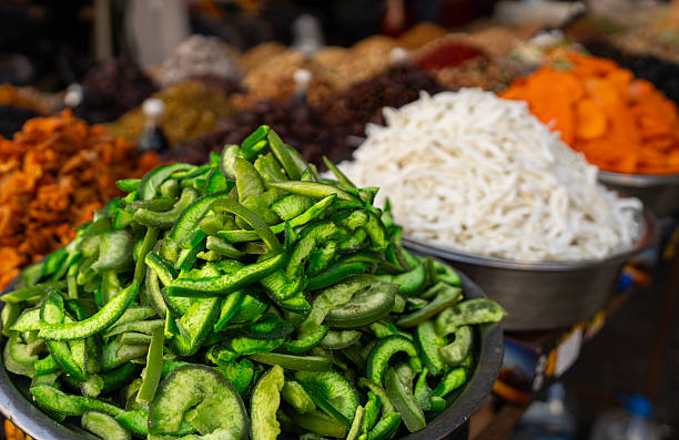 Vibrant assortment of dried pomelo, mango, and coconut slices at a traditional market