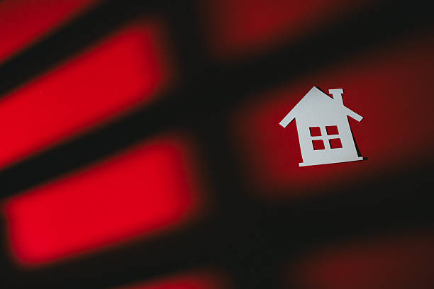 istock Real Estate concept. Paper house model red background shadow pattern home concept minimal design real estate symbol abstract light effect cozy feeling 2259096290