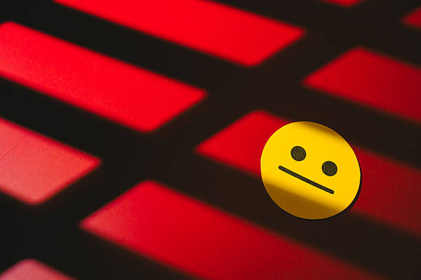 Feedback concept. Neutral face emoji yellow circle red background shadow pattern minimalistic design flat surface simple expression isolated object emoticon graphic.