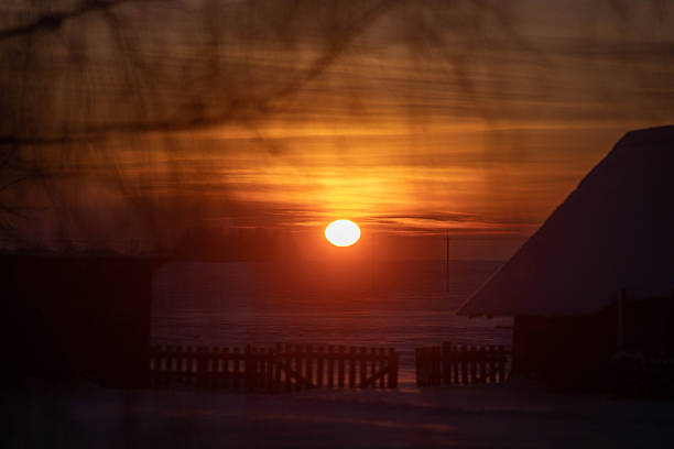 winter sunset in a snowy field