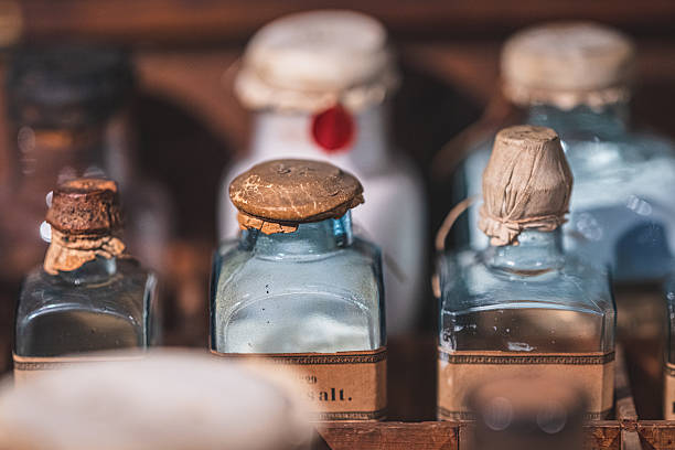 Colorful glass bottles and obsolete tin cans for sale at a flea market