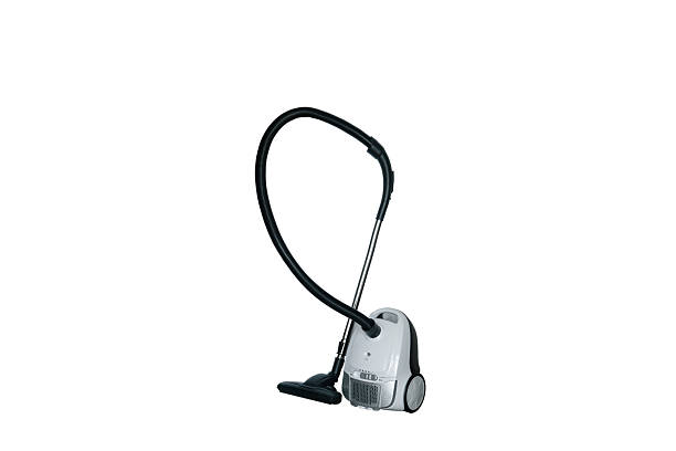 compact, modern vacuum cleaner placed neatly on the floor in a modern apartment.