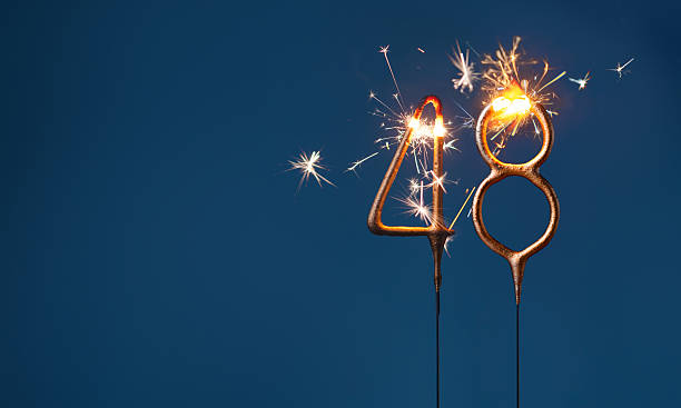 48 years celebration festive background with copy space made with Bengal fire in the form of number Fourty eight.