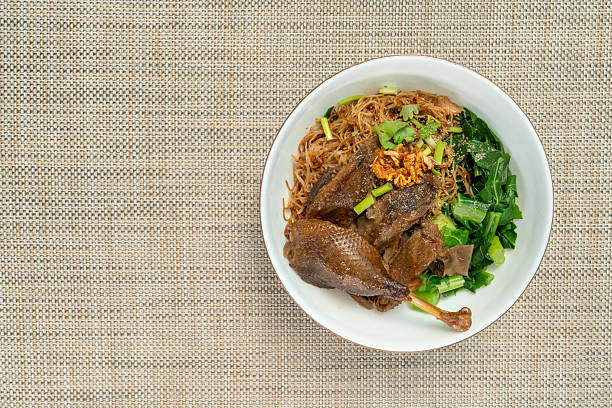 Authentic Cantonese-style croasted goose with rice noodle soup, a classic delicacy