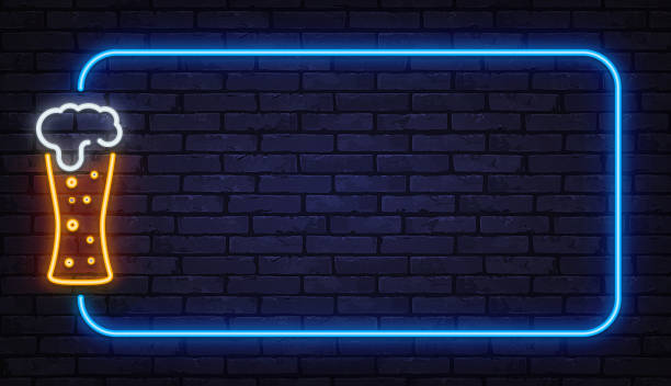 istock Neon beer glass with foam inside glowing frame on brick wall. Nightlife concept suitable for bars, pubs, menus, or festival promotions. 2259164847