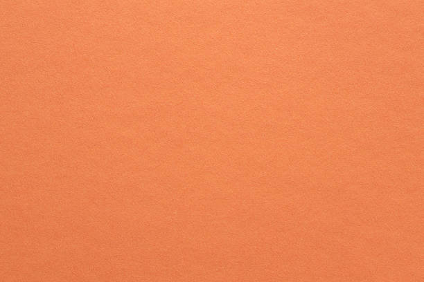 istock Warm Coral Orange Textured Paper Background Minimalist Design with Copy Space Surface 2259166121