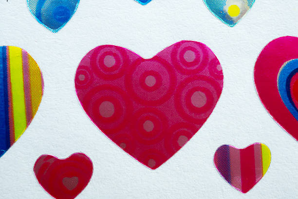 Colorful heart shape stickers with holographic effect on white background