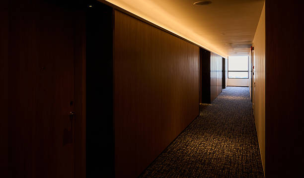 istock Modern hotel corridor with warm lighting and minimalist interior 2259180750